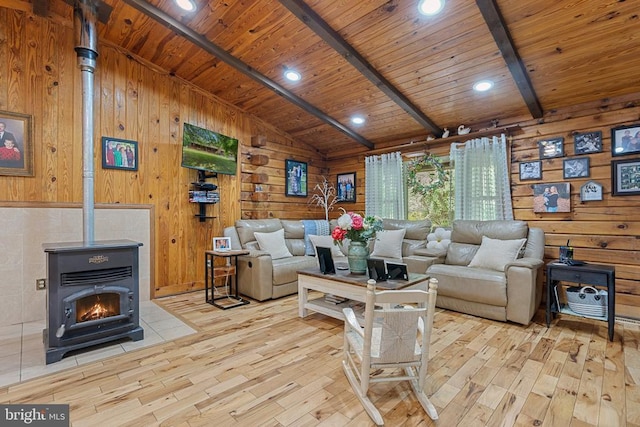 living room featuring light wood-style flooring, wood walls, and wooden ceiling