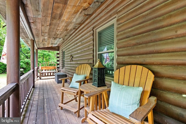 wooden terrace with covered porch and cooling unit