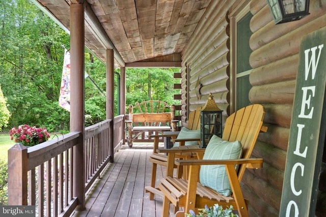 wooden terrace featuring a porch
