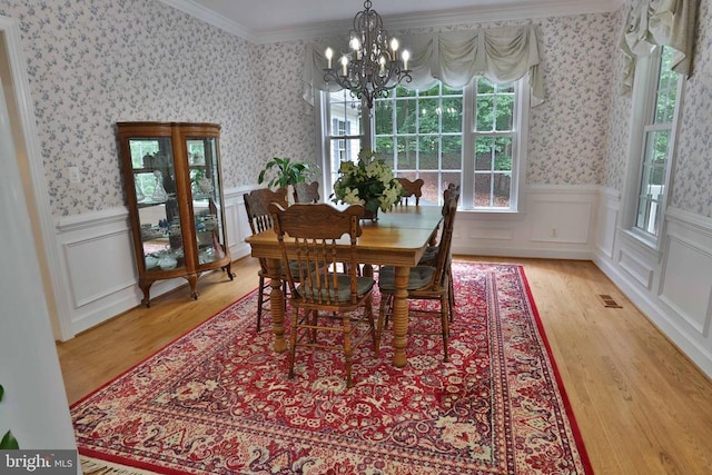 13608 General Slocum Ct S, Fredericksburg, VA 22407 - dining room with a chandelier, ornamental molding, wood finished floors, wallpapered walls, and wainscoting