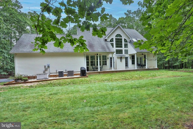 13608 General Slocum Ct S, Fredericksburg, VA 22407 - rear view of house featuring a lawn, a shingled roof, and a wooden deck