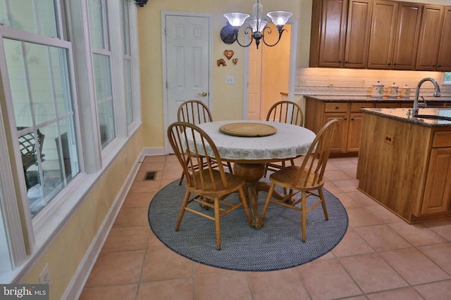 13608 General Slocum Ct S, Fredericksburg, VA 22407 - dining space featuring a chandelier and light tile patterned floors