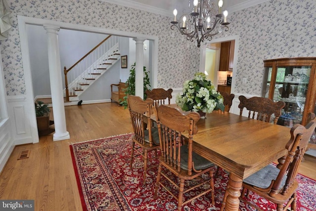 13608 General Slocum Ct S, Fredericksburg, VA 22407 - dining room featuring wallpapered walls, ornamental molding, light wood-style flooring, stairs, and a chandelier