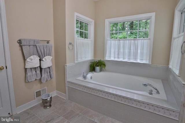 13608 General Slocum Ct S, Fredericksburg, VA 22407 - bathroom featuring a garden tub and baseboards