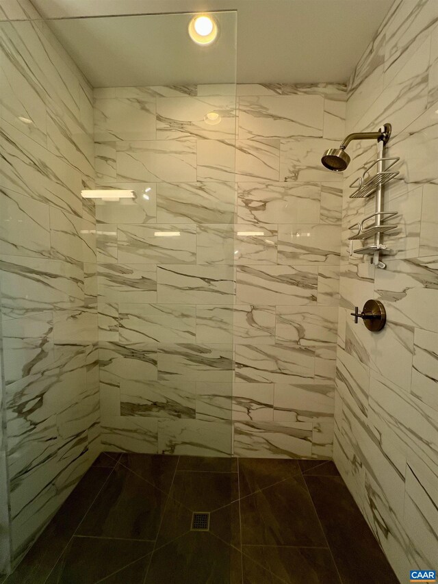 bathroom with a tile shower