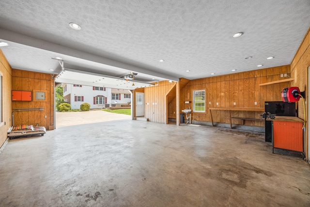 336 Hollingsworth Rd, Woodstock, VA 22664 - garage with wooden walls, a workshop area, and recessed lighting