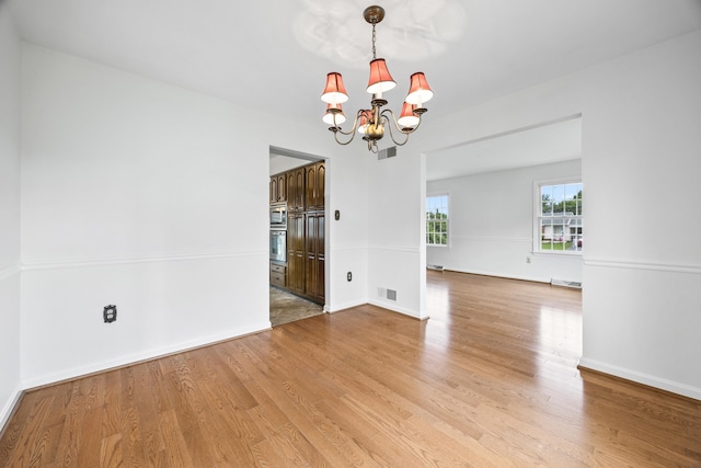 336 Hollingsworth Rd, Woodstock, VA 22664 - spare room with a chandelier and light wood finished floors
