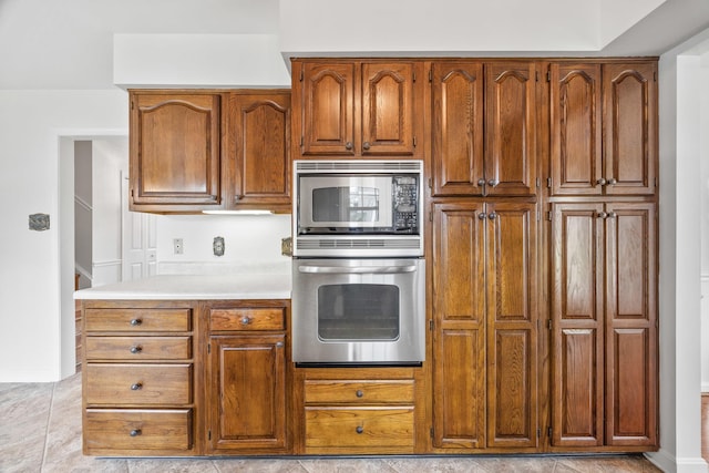 336 Hollingsworth Rd, Woodstock, VA 22664 - kitchen featuring stainless steel appliances, brown cabinets, and light countertops