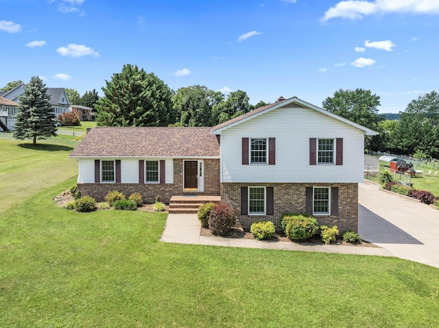 336 Hollingsworth Rd, Woodstock, VA 22664 - tri-level home with brick siding, a front lawn, and driveway