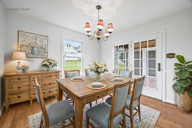 336 Hollingsworth Rd, Woodstock, VA 22664 - dining room featuring a chandelier and light wood-style flooring