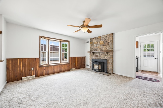 336 Hollingsworth Rd, Woodstock, VA 22664 - unfurnished living room with wainscoting, a ceiling fan, wood walls, and carpet floors