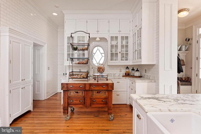 kitchen featuring white cabinets and ornamental molding