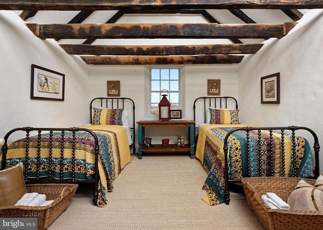carpeted bedroom with lofted ceiling with beams