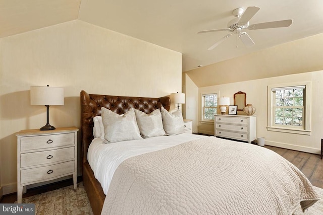 bedroom featuring ceiling fan, lofted ceiling, baseboards, and wood finished floors