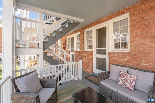 exterior space featuring stairway and outdoor lounge area