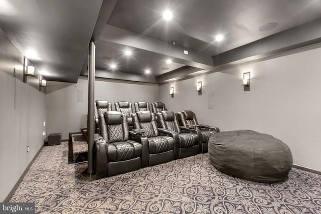 home theater room featuring carpet flooring and baseboards