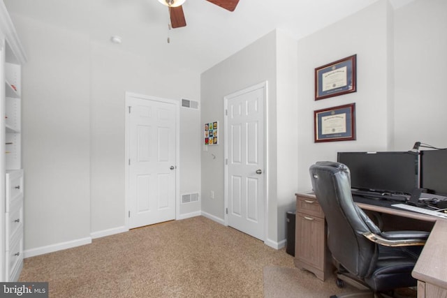 office space with ceiling fan, light colored carpet, baseboards, and visible vents