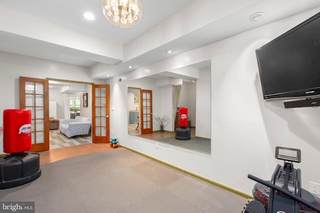 interior space with baseboards, french doors, and recessed lighting