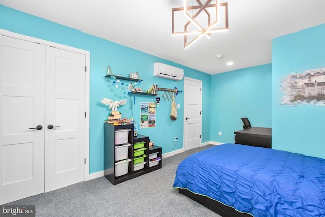 carpeted bedroom featuring a wall mounted air conditioner, baseboards, and recessed lighting