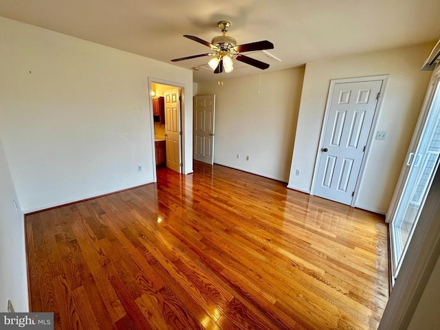 288 Lake Front Dr, Mineral, VA 23117 - unfurnished bedroom with wood finished floors, baseboards, and a ceiling fan