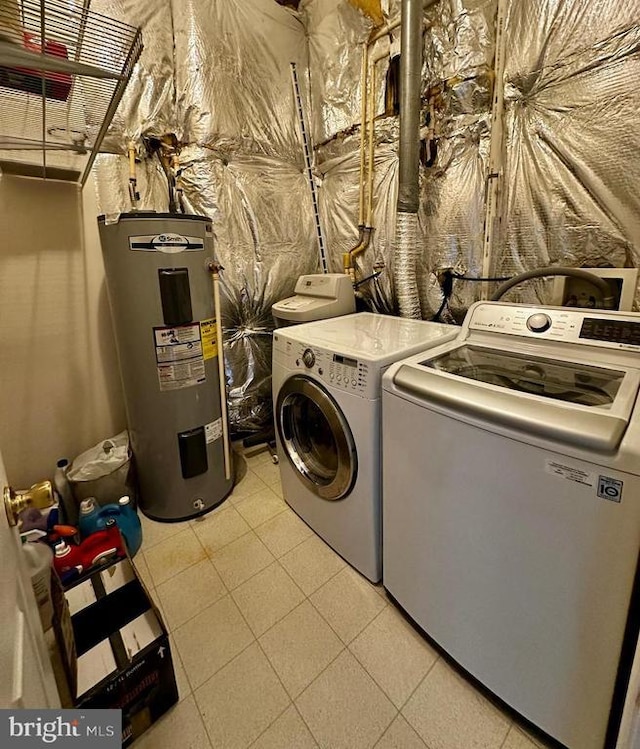 288 Lake Front Dr, Mineral, VA 23117 - laundry room with washer and dryer, water heater, and light tile patterned flooring