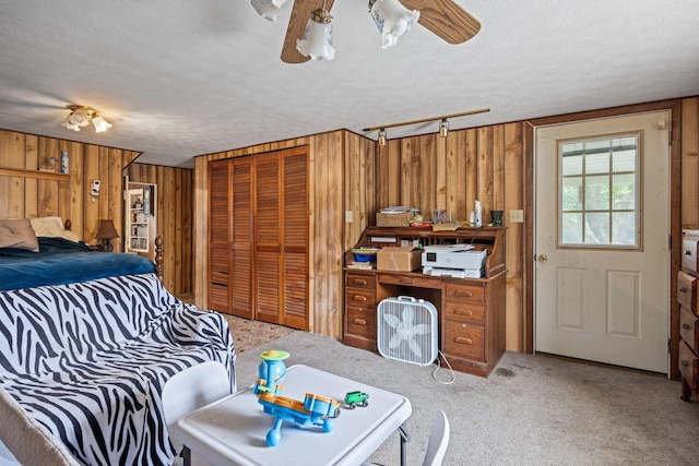 6596 Mayberry Rd, Singers Glen, VA 22850 - bedroom with wooden walls, carpet flooring, a textured ceiling, and a ceiling fan