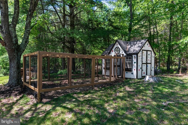 - view of shed featuring a wooded view