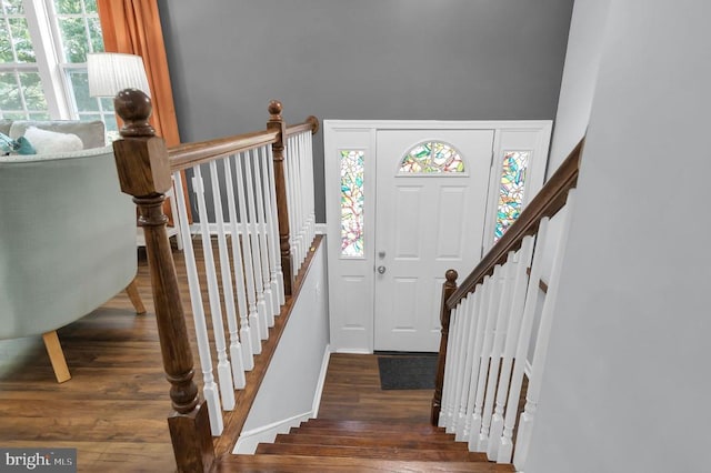  - entryway featuring wood finished floors and baseboards