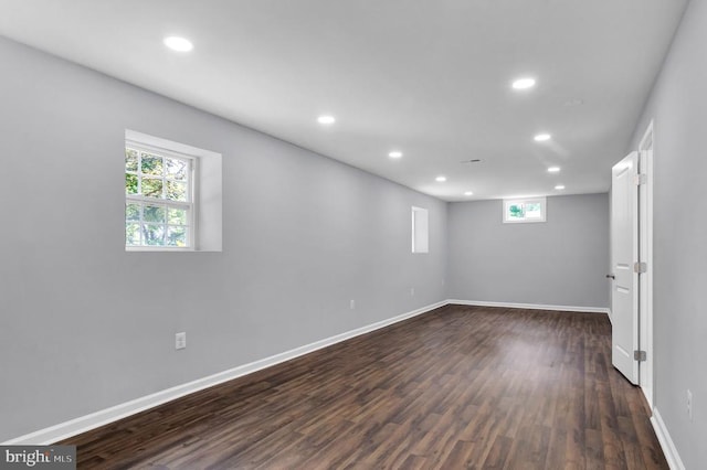  - basement with recessed lighting, dark wood-style flooring, and plenty of natural light