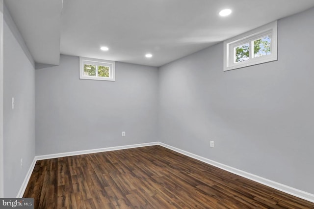  - basement with dark wood-style flooring and recessed lighting