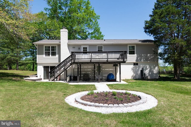  - rear view of house with stairway, a deck, a lawn, a chimney, and an attached garage