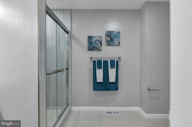  - full bath with a stall shower and tile patterned flooring