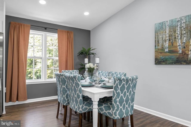  - dining space with wood finished floors, vaulted ceiling, and recessed lighting