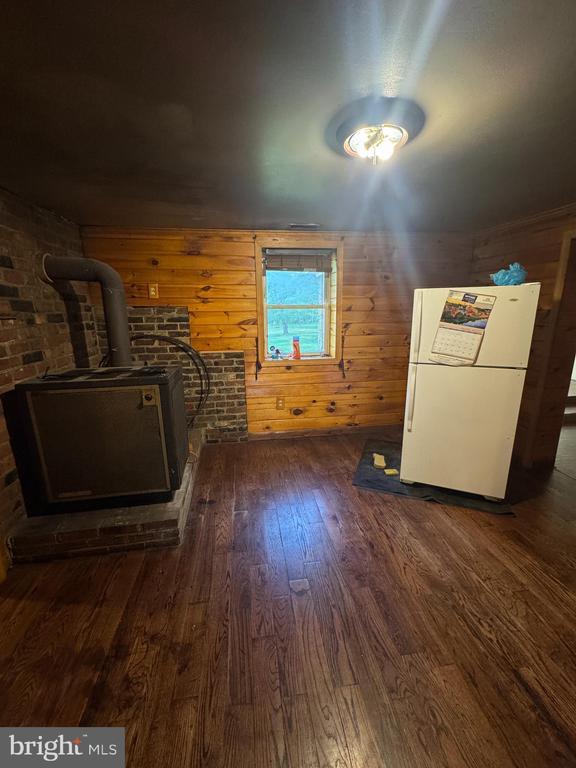 11418 Cox Ml, Gordonsville, VA 22942 - bonus room with wood finished floors, a wood stove, and wooden walls