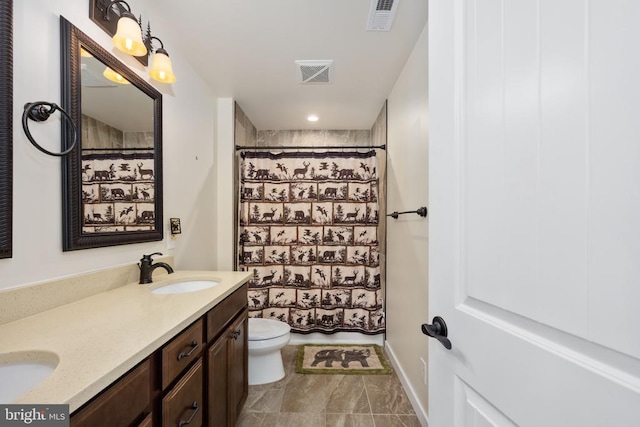10811 Honorable Ct, Spotsylvania, VA 22553 - bathroom featuring toilet, double vanity, a shower with curtain, and recessed lighting