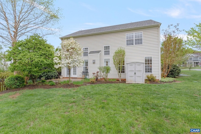 back of house featuring a lawn