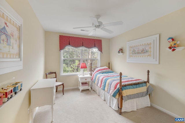 bedroom featuring baseboards, a ceiling fan, visible vents, and carpet floors