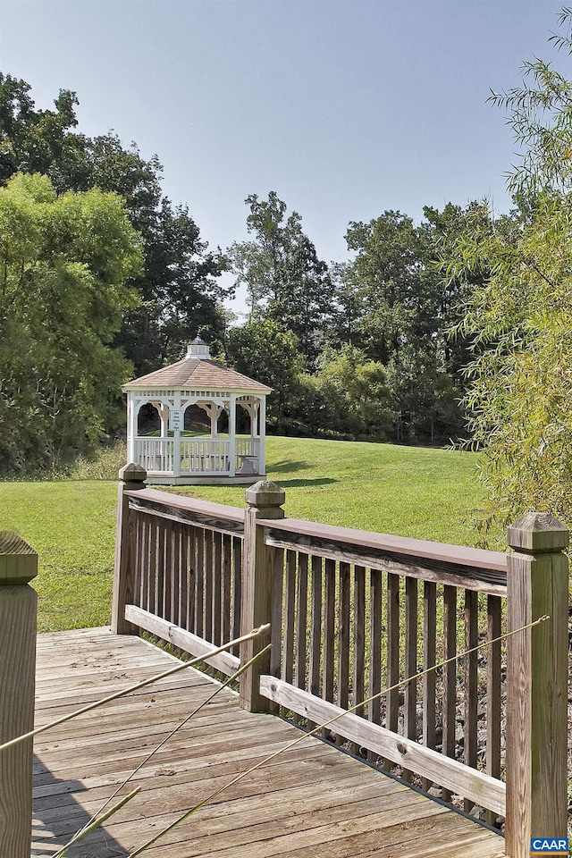 deck with a yard and a gazebo