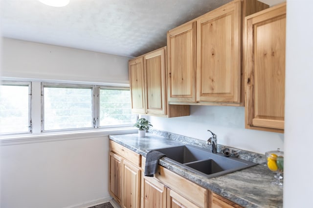 708 Mccorkle Dr, Lexington, VA 24450 - kitchen featuring light brown cabinetry, a sink, and a textured ceiling