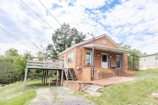 708 Mccorkle Dr, Lexington, VA 24450 - view of front of property featuring brick siding, a front lawn, stairs, gravel driveway, and a deck