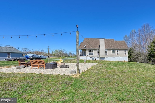 26368 Pennfields Dr, Orange, VA 22960 - back of house with crawl space, a chimney, and a lawn