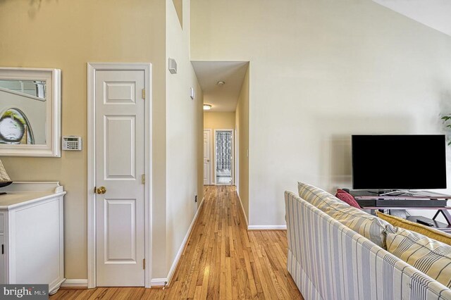 26368 Pennfields Dr, Orange, VA 22960 - hall with light wood-style floors, baseboards, and a towering ceiling
