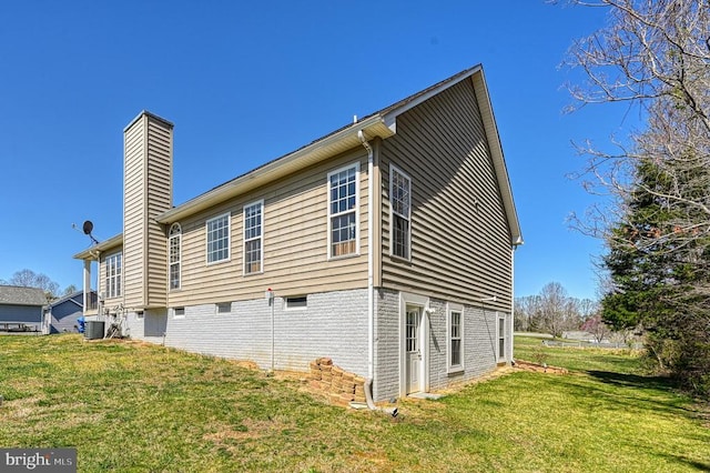 26368 Pennfields Dr, Orange, VA 22960 - view of side of property with a yard, cooling unit, and a chimney