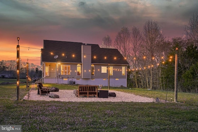 26368 Pennfields Dr, Orange, VA 22960 - back of property at dusk with a yard and a chimney