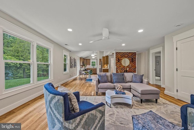  - living room featuring ceiling fan, light wood-style floors, healthy amount of natural light, and recessed lighting