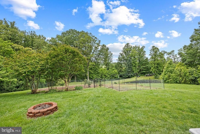  - view of yard featuring an outdoor fire pit