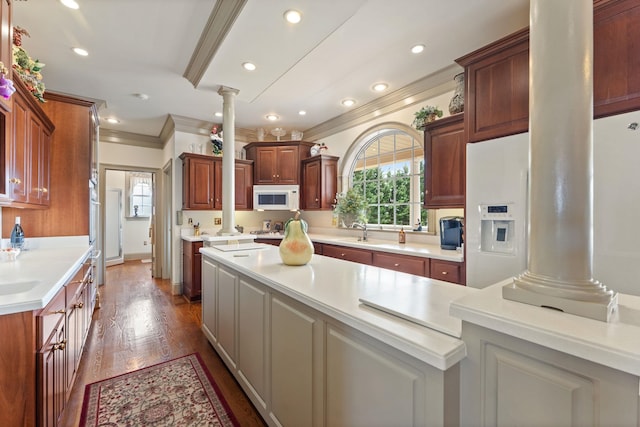 273 Bel Grene Dr, Fishersville, VA 22939 - kitchen with a sink, decorative columns, white microwave, crown molding, and light countertops