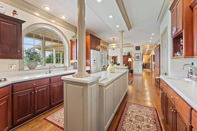 273 Bel Grene Dr, Fishersville, VA 22939 - kitchen featuring a sink, white refrigerator with ice dispenser, light countertops, and decorative columns