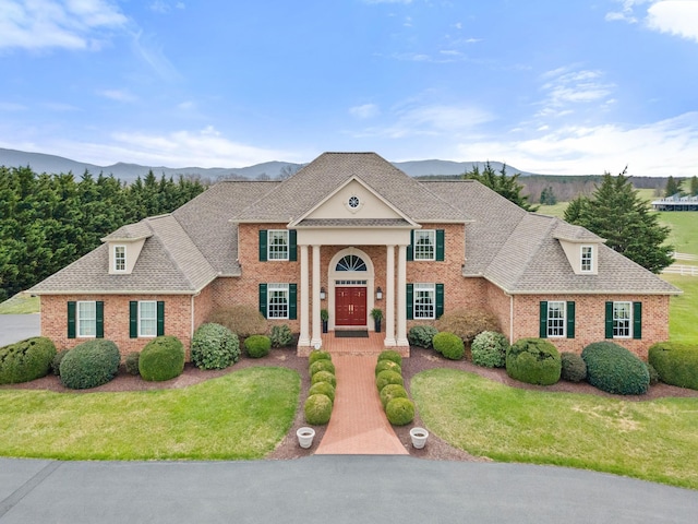 273 Bel Grene Dr, Fishersville, VA 22939 - greek revival house featuring brick siding, a front lawn, and a mountain view