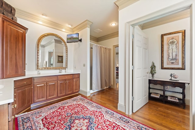 273 Bel Grene Dr, Fishersville, VA 22939 - bathroom featuring wood finished floors, vanity, curtained shower, ornamental molding, and baseboards